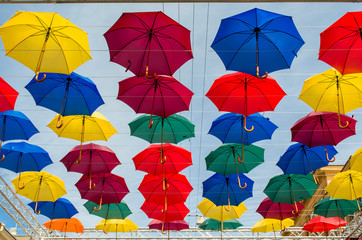 Fototapeta na wymiar colorful umbrellas hanging in rows