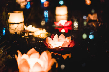 Chinese lanterns floating in lake