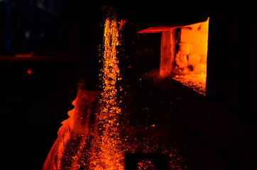 Metal on casting. Blast furnace. Metallurgy. For abstract background and texture.  High temperature in the melting furnace. Metallurgical industry. © MaxSafaniuk