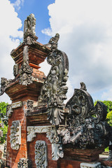 Fototapeta na wymiar Details of a public Hindi temple's gate in Bali, Indonesia