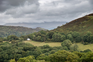 Landscape image of view from Precipice Walk in Snowdonia overlooking Barmouth and Coed-y-Brenin forest during rainy afternoon in September