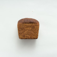 Freshly baked bread on white background, top view