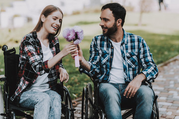 Couple of Disabled People on Wheelchairs on Date.