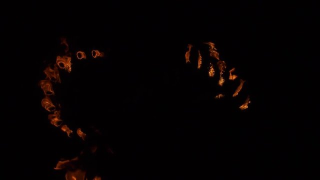 night fire show with torches and dancing