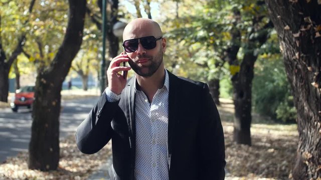 Handsome businessman talking on the phone