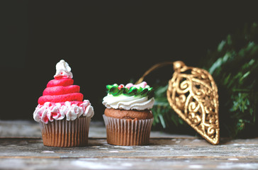 Vanilla cupcakes with christmas decoration ; holiday background with copy space