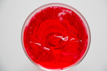 Red soda with ice top view