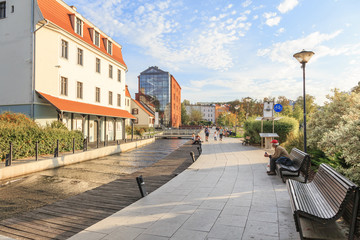 Promenade on Brda River in Bydgoszcz, on the Mill Island. - obrazy, fototapety, plakaty