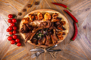 Juicy barbeque pork ribs and dry chicken wings with glaze. Snacks for beer