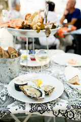 Plate with fresh assorted seafood in french summer restaurant