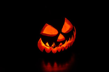 Spooky halloween pumpkin on a black background