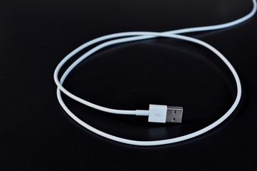White data cable connector with USB isolated on black background