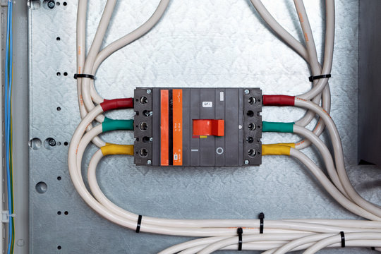 One Large Power Circuit Breaker In The Electrical Cabinet. Many Cables Or Wires Are Connected To The Switch. Big Bunch Of Wires. Distribution Of Electricity In Networks. Reliable Protection.