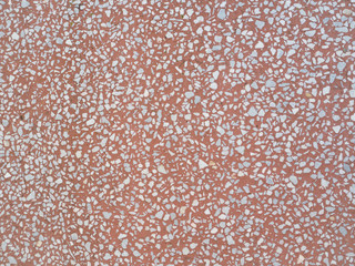 Texture of pink stone interspersed with granite.
