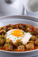 Beef meatballs with egg, on a plate