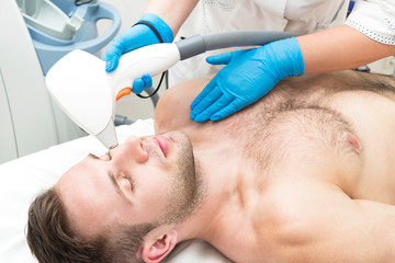 Obraz na płótnie Canvas Man on the procedure of laser hair removal in the beauty salon