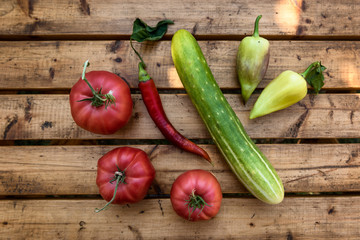 Organic Vegetables from a Small Garden on a Rustic Wooden Table - Tomatoes, Cucumber, Paprika, Bell Pepper, Chili Pepper