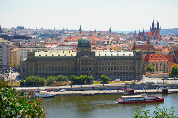 View of Prague with Vltava and amazing buildings with red roofs. Concept of Czech Republic...