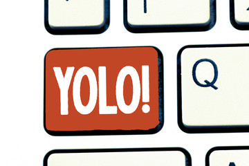 Writing note showing Yolo. Business photo showcasing stand for You only live once popular phase among students and teens.