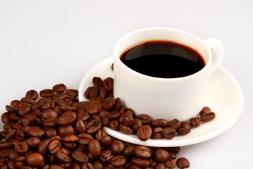 Cup Of Coffee And Coffee Beans