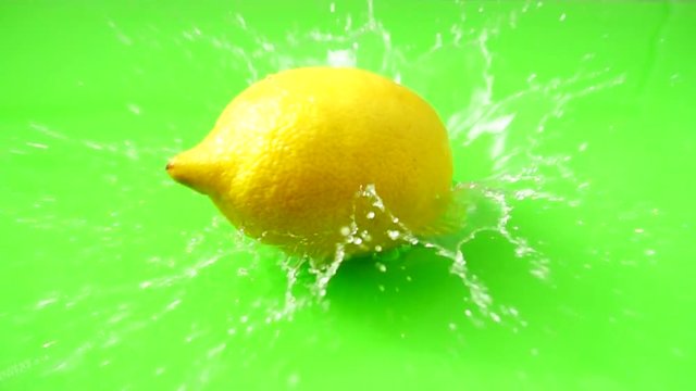 Falling of a lemon in water. Slow motion.