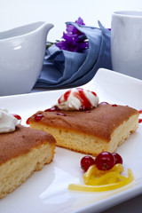 Sobaos pasiegos on a plate, typical sweet of Santander, Spain.