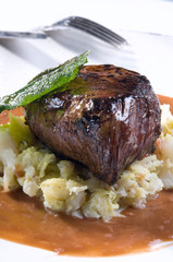 Close-up of a beef tenderloin with sage 
