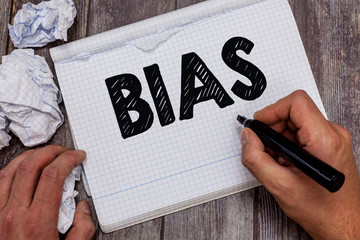 Handwriting text Bias. Concept meaning Prejudice in favor of and against one thing Considered to be...