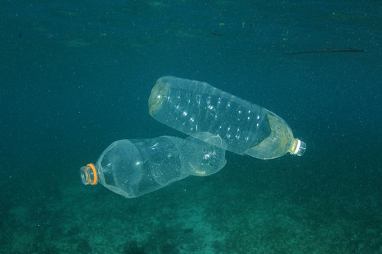 Plastic bags, bottles and straws pollution in ocean 