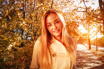 Slim young woman and closeup of face. Golden sunset time. 