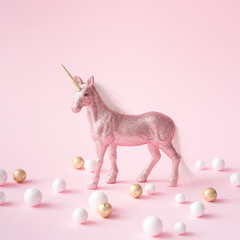 Pink glitter unicorn with gold and white decoration.Magic surreal style. Minimal composition. © Zamurovic Brothers