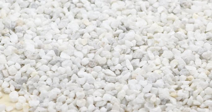 White split stones on a rotating plate