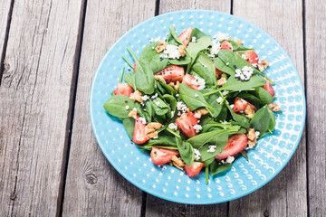Strawberry salad with spinach , cheese and walnut