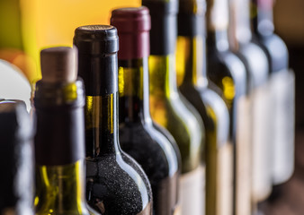 Line of wine bottles. Close-up.
