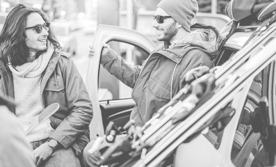 Happy friends at ski vacation village for winter sporty holidays outdoor