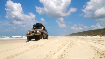 Fototapeta na wymiar Offroad vehicle at the beach