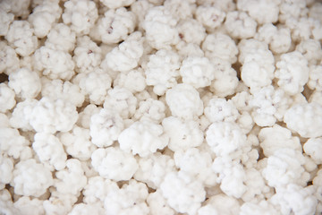 Candied peanuts background. peanuts in caramel sugar icing white texture