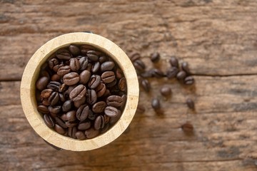 Coffee beans in a wooden pot