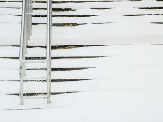 Steps, railings, white snow