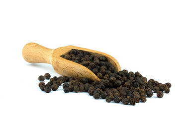 Black pepper on wooden scoop isolated on white background