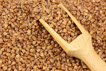 Buckwheat scattered with a wooden scoop