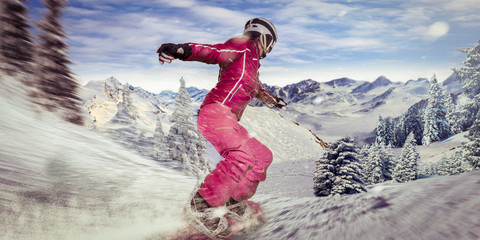 single woman on snowboard gliding through a curve down the hill with high speed. powder snow flying...