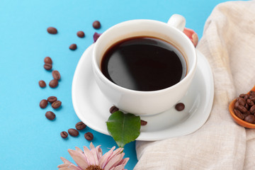 Cup of coffee on a blue table