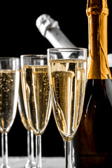 glasses of champagne with the bottle