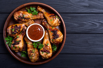 Grilled chicken legs with tomato sauce