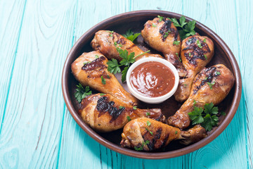 Grilled chicken legs with tomato sauce