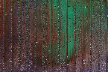 abstract background with big and small water drops in different colors - dark red and green