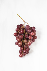 Red grapes on a white background