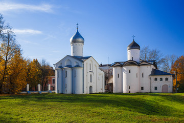 Fototapeta na wymiar Ancient russian churches on Yaroslav Courtyard in historical area. Veliky Novgorod (Novgorod the Great), Russia.