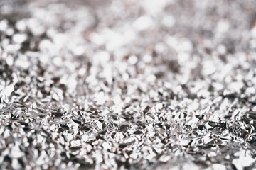 CLOSE UP CRUMPLED ALUMINUM FOIL TEXTURE FOR BACKGROUND